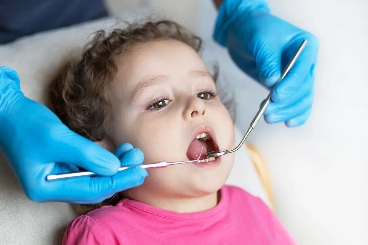 Child receiving a gentle dental exam