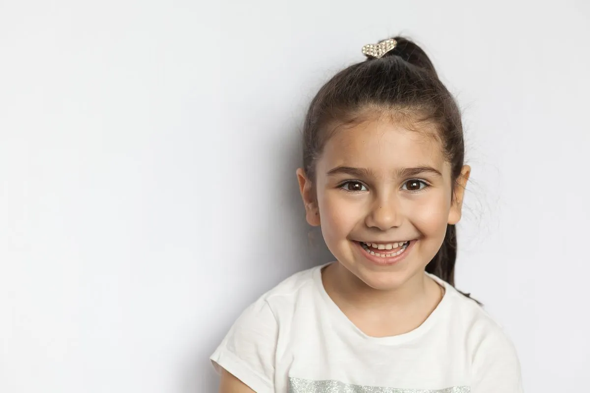 Child with a confident smile